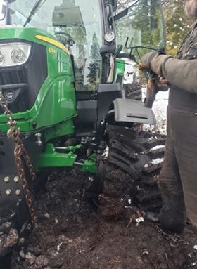 She's really stuck, snowmobile trail groomer, recovery effort successful 